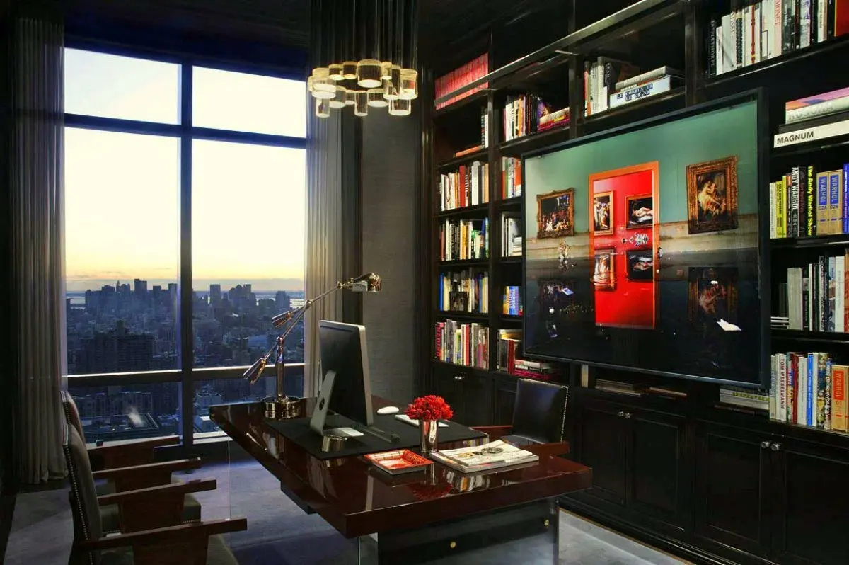 A private office library with a desk and a city view.